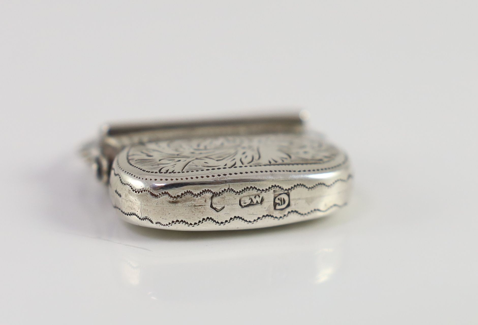 A George IV engraved silver vinaigrette, modelled as a handbag, by Gervase Wheeler